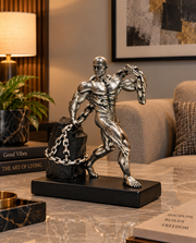StrengthBound Muscle Man Pulling Chain Sculpture – view 2